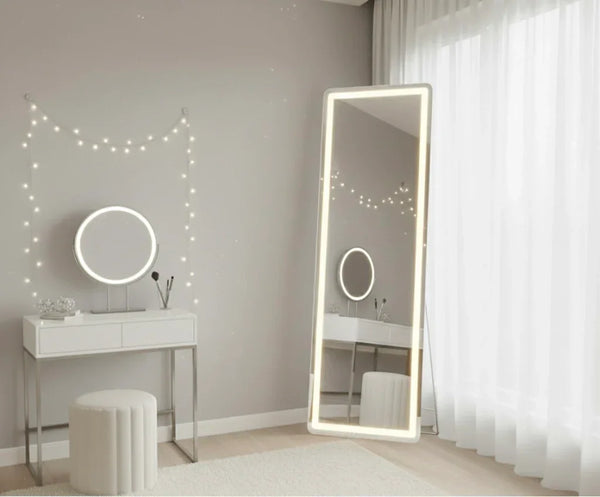 LED vanity mirror on white makeup table with round stool in modern bedroom